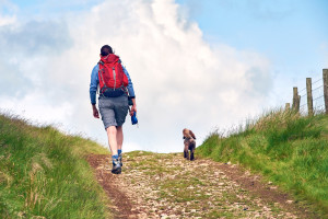 Woman walking outside with her dog